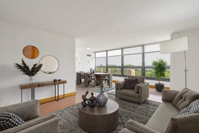 360 E Randolph St Unit 503, Chicago, IL 60601 - living room featuring arched walkways, wood finished floors, and healthy amount of natural light
