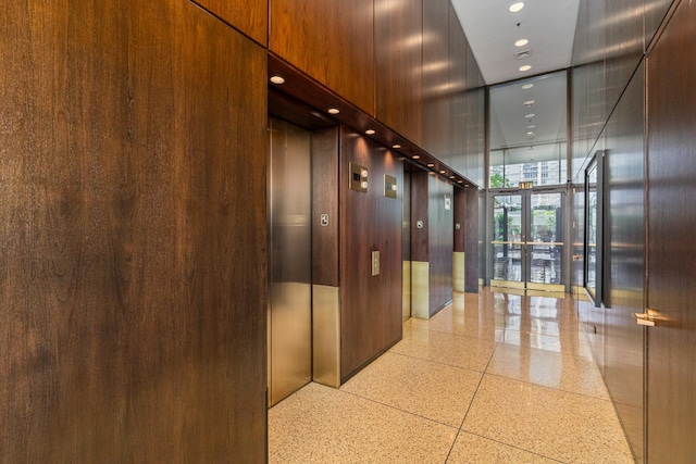 360 E Randolph St Unit 503, Chicago, IL 60601 - hallway featuring dark aggregate flooring, elevator, and recessed lighting