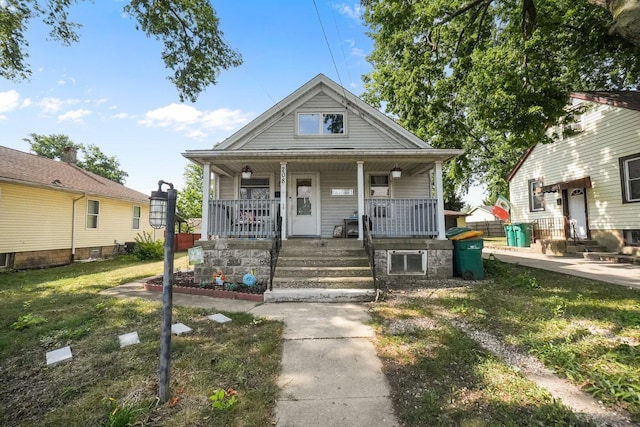 208 Frank Ave, Joliet, IL 60435 - view of front of house with covered porch and a front yard