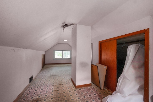 208 Frank Ave, Joliet, IL 60435 - additional living space featuring vaulted ceiling and baseboards