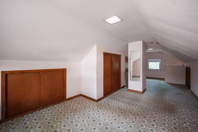 208 Frank Ave, Joliet, IL 60435 - additional living space with lofted ceiling and baseboards
