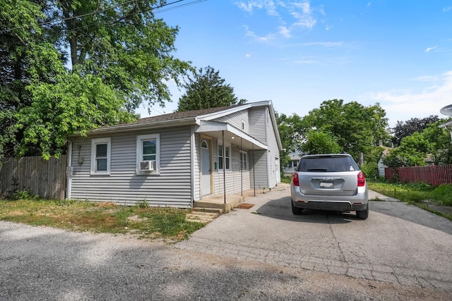 208 Frank Ave, Joliet, IL 60435 - view of front facade with cooling unit and asphalt driveway