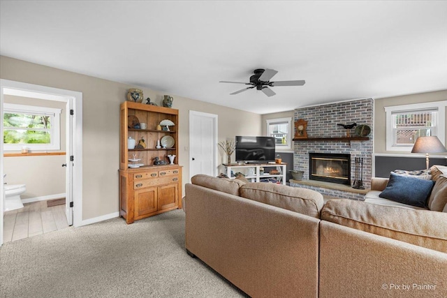 2519 Penn Blvd, Lindenhurst, IL 60046 - living room featuring a ceiling fan, a fireplace, and light carpet