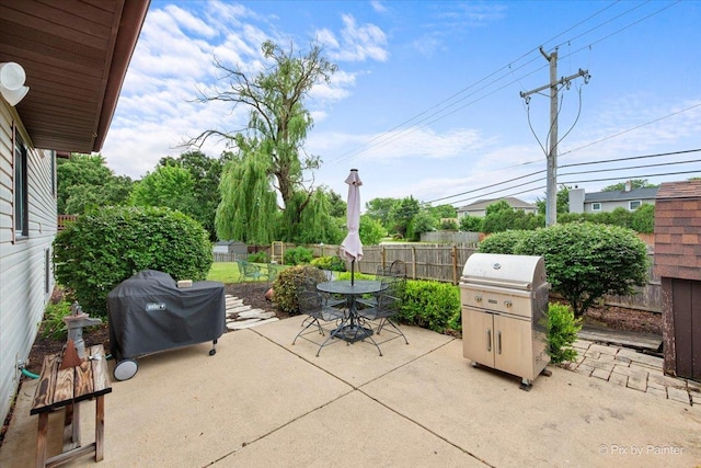 2519 Penn Blvd, Lindenhurst, IL 60046 - fenced backyard with a patio area, a grill, and outdoor dining area