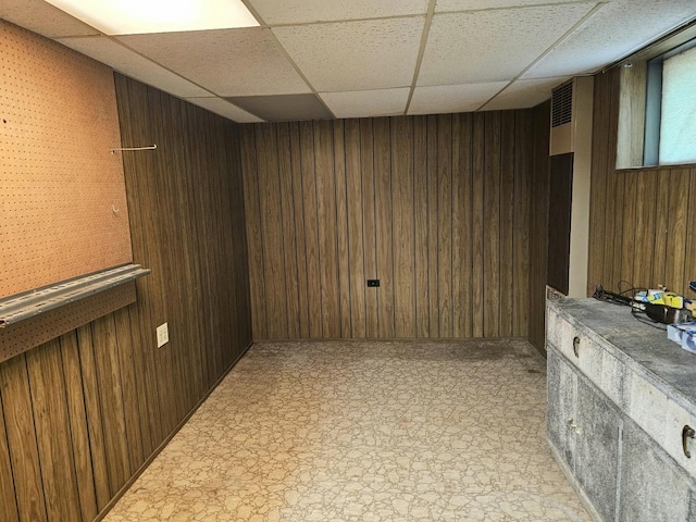 3N736 Locust Ave, West Chicago, IL 60185 - finished basement with a paneled ceiling, wooden walls, and light floors