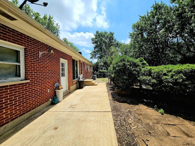 3N736 Locust Ave, West Chicago, IL 60185 - view of home's exterior with brick siding and a patio area