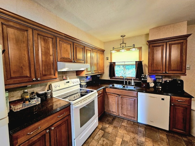 3N736 Locust Ave, West Chicago, IL 60185 - kitchen featuring white appliances, under cabinet range hood, dark countertops, and backsplash