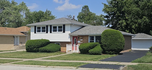 16961 Parkside Ave, South Holland, IL 60473 - split level home featuring brick siding, a front yard, and roof with shingles