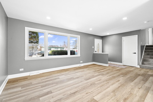 16961 Parkside Ave, South Holland, IL 60473 - unfurnished room featuring stairway, light wood-style flooring, and recessed lighting