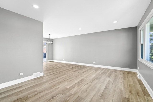 16961 Parkside Ave, South Holland, IL 60473 - empty room featuring a chandelier, light wood finished floors, and recessed lighting