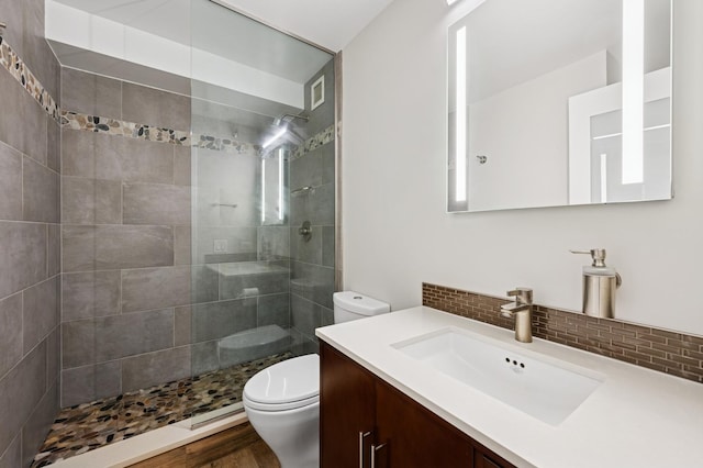1250 N Dearborn St Unit 10B, Chicago, IL 60610 - bathroom with vanity, a walk in shower, and decorative backsplash