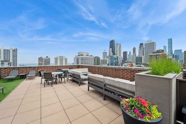 1250 N Dearborn St Unit 10B, Chicago, IL 60610 - view of patio with a skyline view and an outdoor hangout area