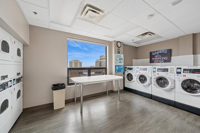 1250 N Dearborn St Unit 10B, Chicago, IL 60610 - community laundry with estacked washer and dryer, wood finished floors, and washing machine and dryer