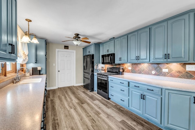 9822 W Pauling Rd, Monee, IL 60449 - kitchen with stainless steel gas range oven, blue cabinets, and fridge with ice dispenser