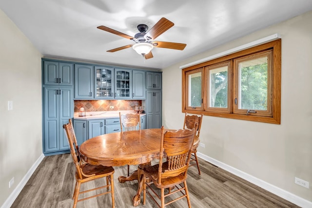 9822 W Pauling Rd, Monee, IL 60449 - dining area featuring light wood-type flooring, ceiling fan, and bar area