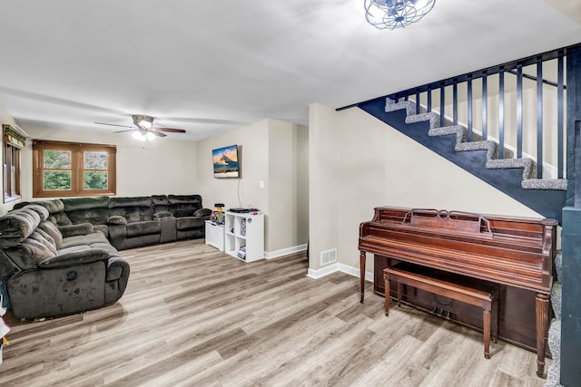 9822 W Pauling Rd, Monee, IL 60449 - living room with wood finished floors, a ceiling fan, and stairway