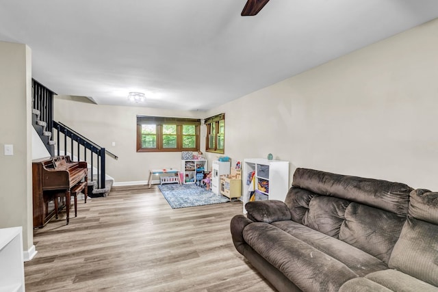 9822 W Pauling Rd, Monee, IL 60449 - living area featuring stairway, light wood-style floors, and ceiling fan