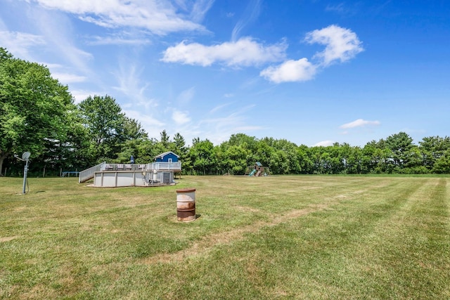 9822 W Pauling Rd, Monee, IL 60449 - view of green lawn featuring a playground and view of wooded area