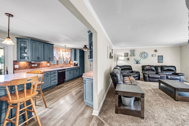 9822 W Pauling Rd, Monee, IL 60449 - living room with healthy amount of natural light, ornamental molding, a ceiling fan, and light wood-style floors
