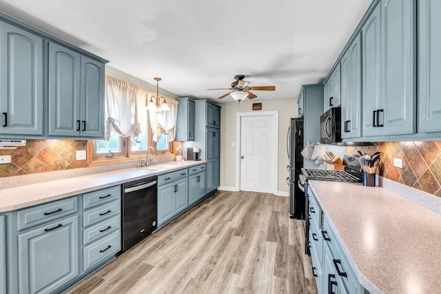 9822 W Pauling Rd, Monee, IL 60449 - kitchen featuring black appliances, a ceiling fan, blue cabinetry, and light countertops