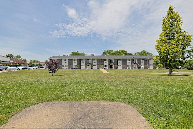 9562 Park Ln Unit 1D, Des Plaines, IL 60016 - view of front of house with a front lawn and uncovered parking