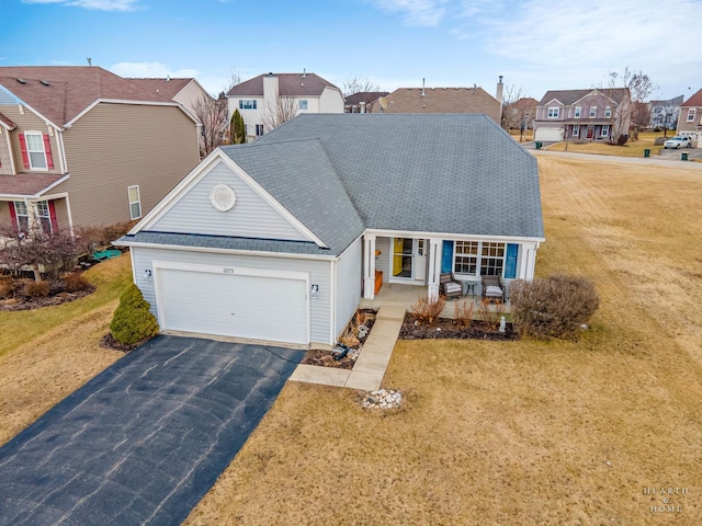 1075 Christine Ln, Antioch, IL 60002 - traditional-style house with a residential view, a garage, driveway, and a front lawn