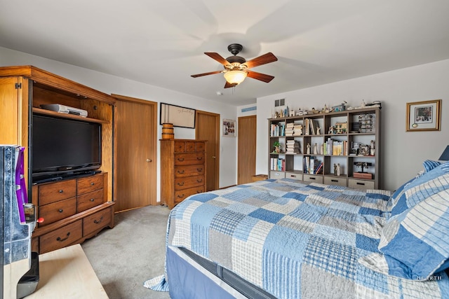 1075 Christine Ln, Antioch, IL 60002 - bedroom with light carpet, ceiling fan, and two closets