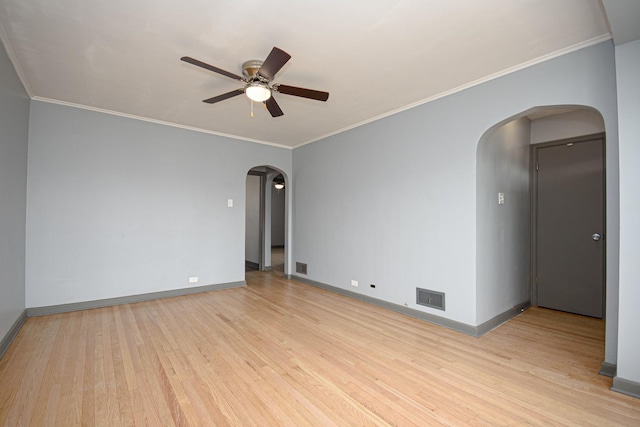 5533 S Menard Ave, Chicago, IL 60638 - unfurnished room featuring arched walkways, a ceiling fan, light wood-style floors, and ornamental molding