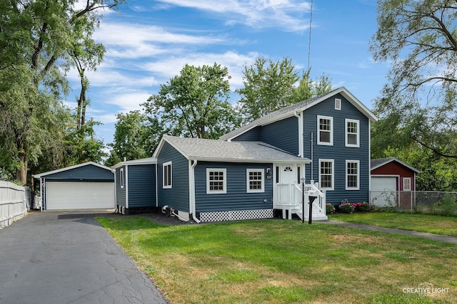 829 Liberty St, Aurora, IL 60505 - traditional-style home featuring an outdoor structure, a detached garage, and a shingled roof