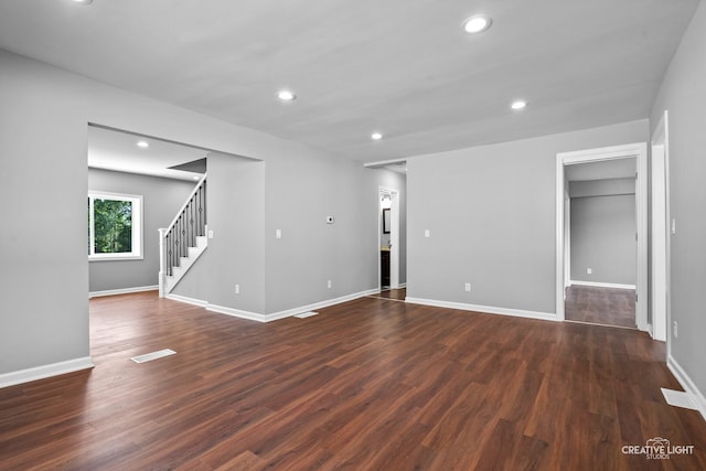 829 Liberty St, Aurora, IL 60505 - unfurnished room with dark wood-type flooring, stairs, and recessed lighting