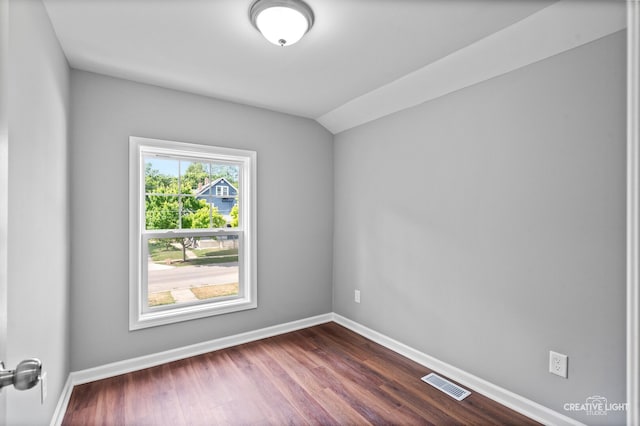 829 Liberty St, Aurora, IL 60505 - empty room featuring dark wood-type flooring and lofted ceiling