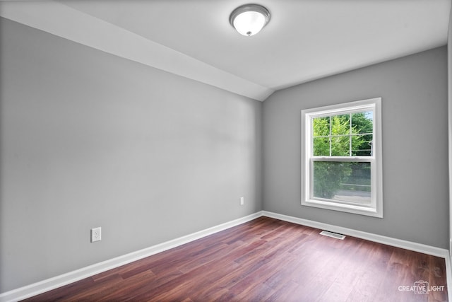 829 Liberty St, Aurora, IL 60505 - spare room with dark wood finished floors and vaulted ceiling