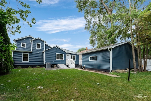 829 Liberty St, Aurora, IL 60505 - back of house with a yard and entry steps