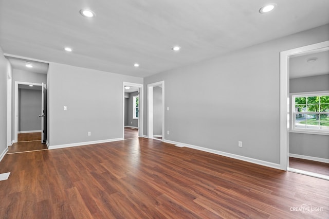 829 Liberty St, Aurora, IL 60505 - empty room featuring dark wood-style flooring and recessed lighting