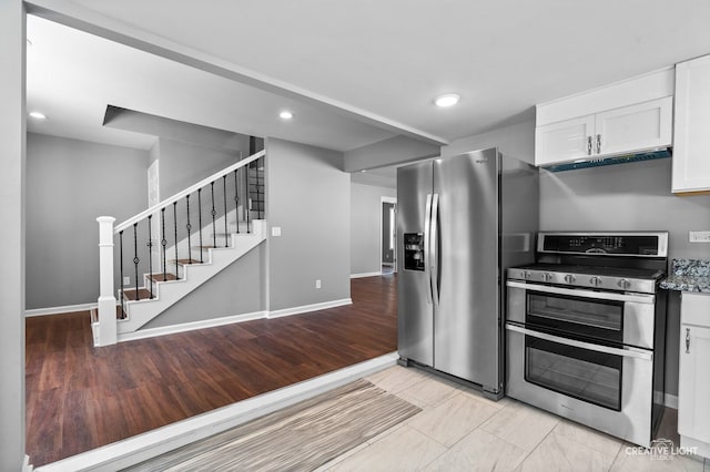829 Liberty St, Aurora, IL 60505 - kitchen with stainless steel appliances, white cabinets, and recessed lighting