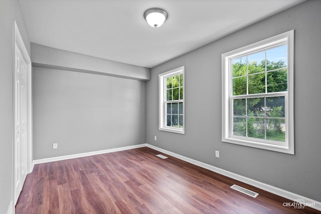829 Liberty St, Aurora, IL 60505 - empty room featuring wood finished floors