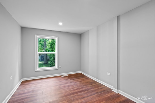 829 Liberty St, Aurora, IL 60505 - spare room featuring dark wood finished floors and recessed lighting