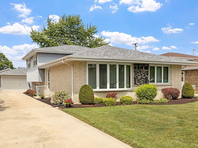 8424 Moody Ave, Burbank, IL 60459 - view of front of property featuring an outbuilding, brick siding, a front lawn, and a shingled roof