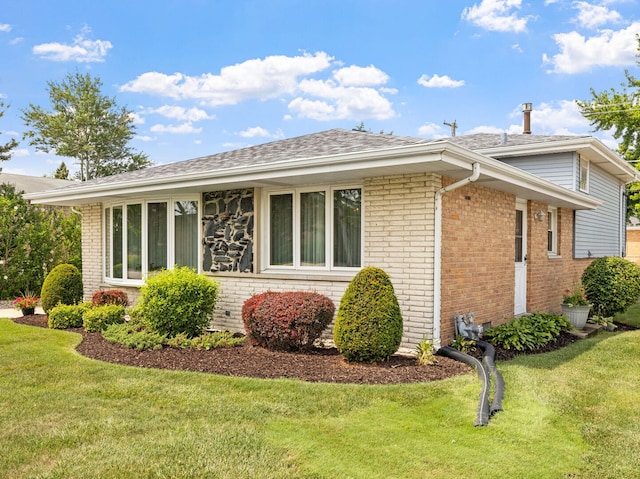 8424 Moody Ave, Burbank, IL 60459 - view of property exterior with brick siding, a lawn, and a shingled roof