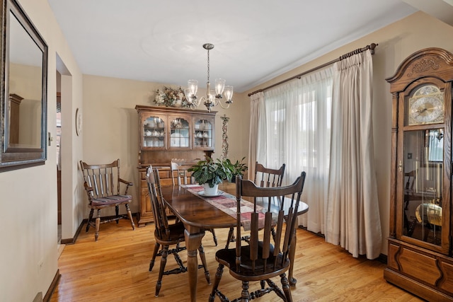 8424 Moody Ave, Burbank, IL 60459 - dining room featuring a chandelier and light wood-style floors