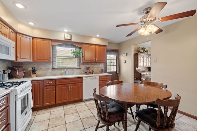 8424 Moody Ave, Burbank, IL 60459 - kitchen featuring white appliances, light countertops, backsplash, a ceiling fan, and recessed lighting