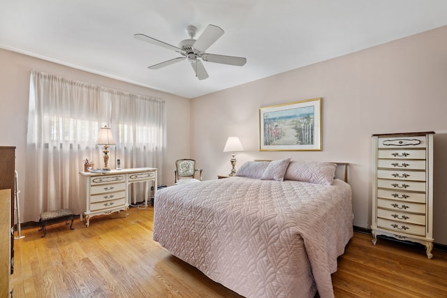 8424 Moody Ave, Burbank, IL 60459 - bedroom featuring wood finished floors and a ceiling fan