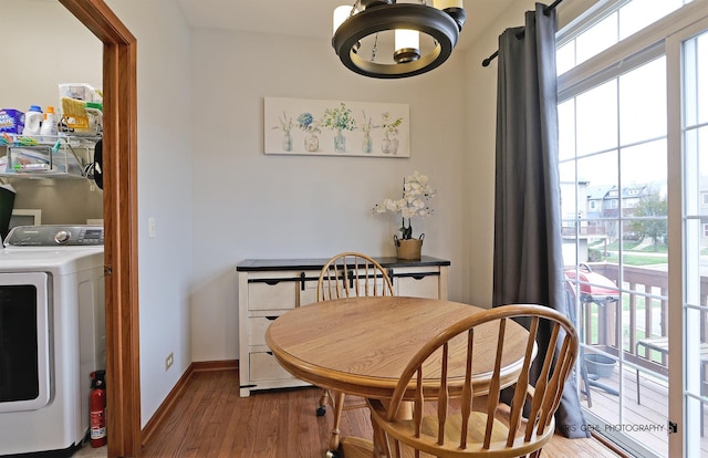 78 Thomas Ct, Grayslake, IL 60030 - dining room with washer / clothes dryer, healthy amount of natural light, wood finished floors, and a chandelier