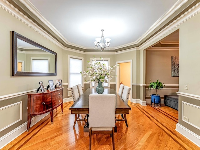 3139 Ridgeland Ave, Berwyn, IL 60402 - dining area featuring a chandelier, light wood-type flooring, crown molding, and a wainscoted wall
