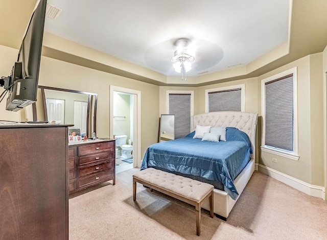 3139 Ridgeland Ave, Berwyn, IL 60402 - bedroom featuring light colored carpet, a raised ceiling, ensuite bathroom, and ceiling fan