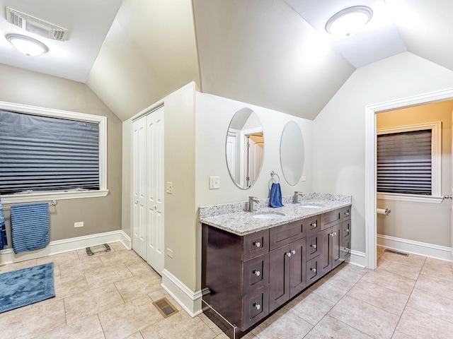 3139 Ridgeland Ave, Berwyn, IL 60402 - bathroom with lofted ceiling, double vanity, and tile patterned floors