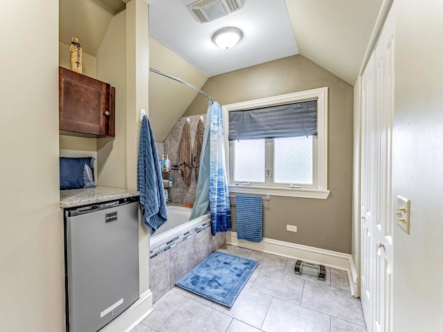 3139 Ridgeland Ave, Berwyn, IL 60402 - bathroom featuring vaulted ceiling, tiled shower / bath combo, and tile patterned floors