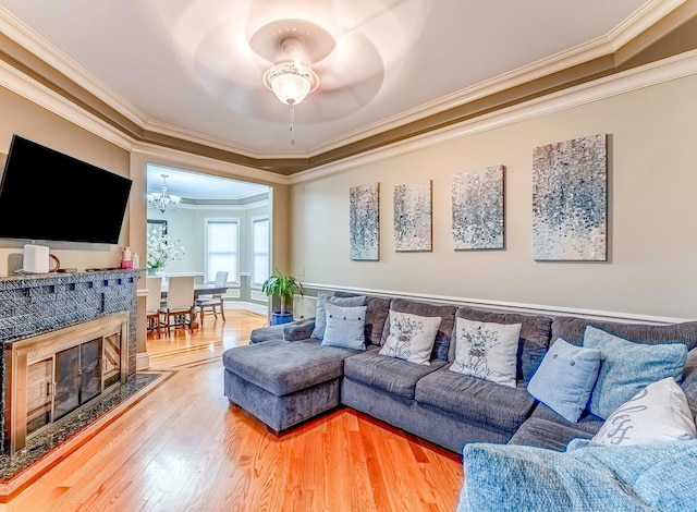 3139 Ridgeland Ave, Berwyn, IL 60402 - living room with crown molding, a ceiling fan, wood finished floors, and a tiled fireplace