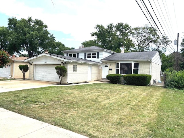 1933 Birch St, Des Plaines, IL 60018 - view of front of house with brick siding, an attached garage, driveway, and a front lawn
