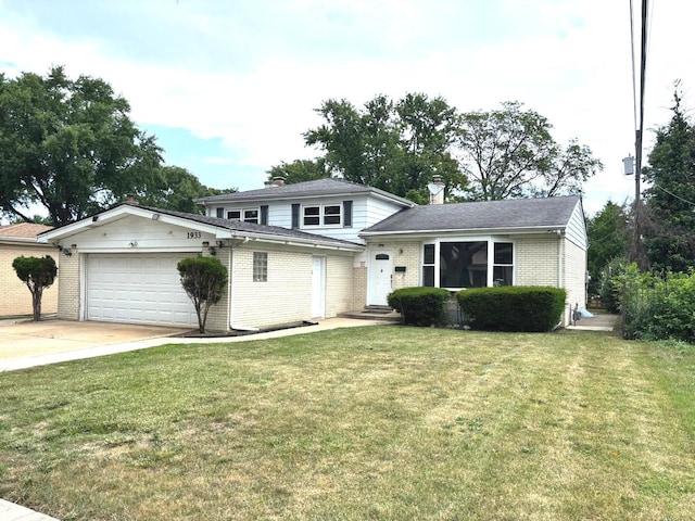 1933 Birch St, Des Plaines, IL 60018 - view of front of home with brick siding, driveway, an attached garage, and a front yard